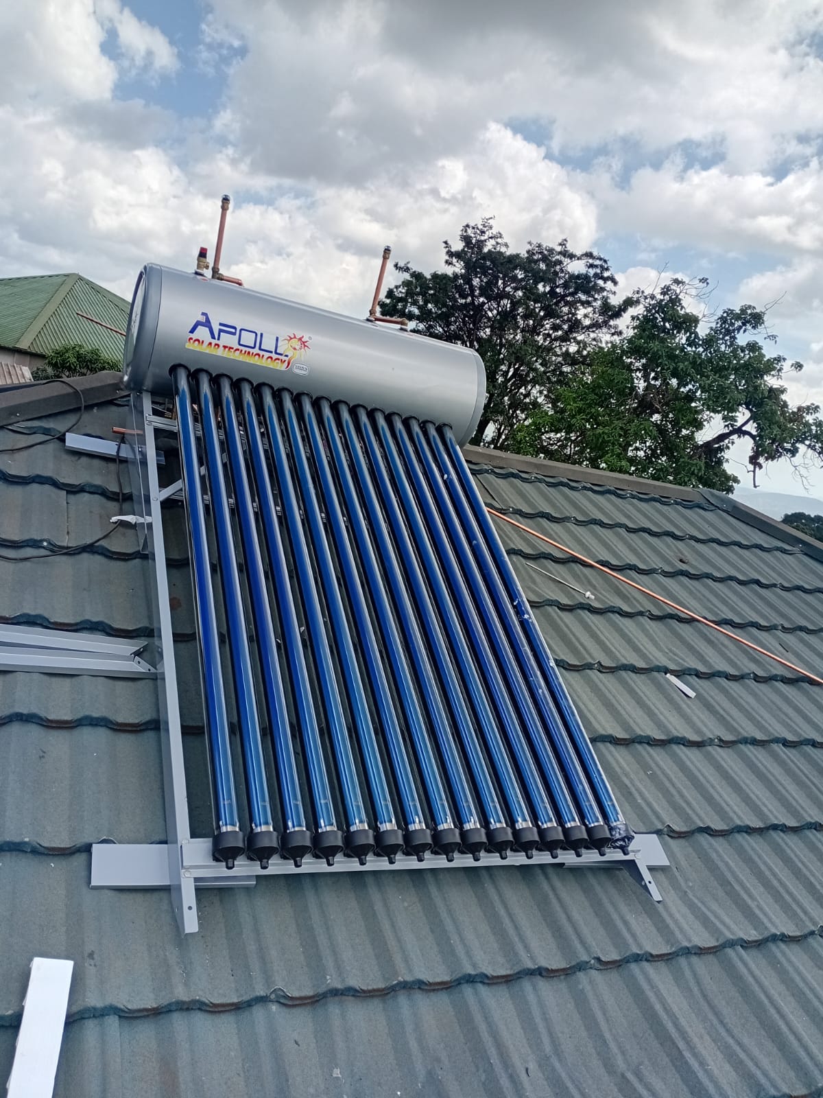 Solar geyser with evacuated tubes installed on a tiled roof