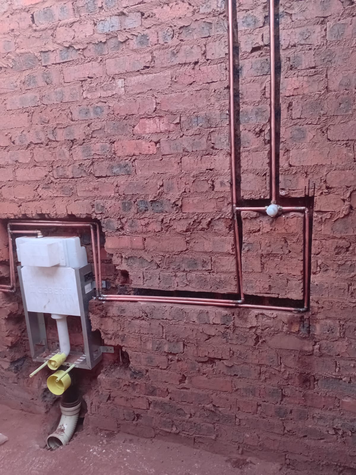 Exposed copper water pipework run and cistern connection during a leak detection and repair job by Pfano & Given Plumbing